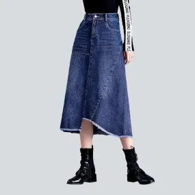 Asymmetric hem whiskered denim skirt