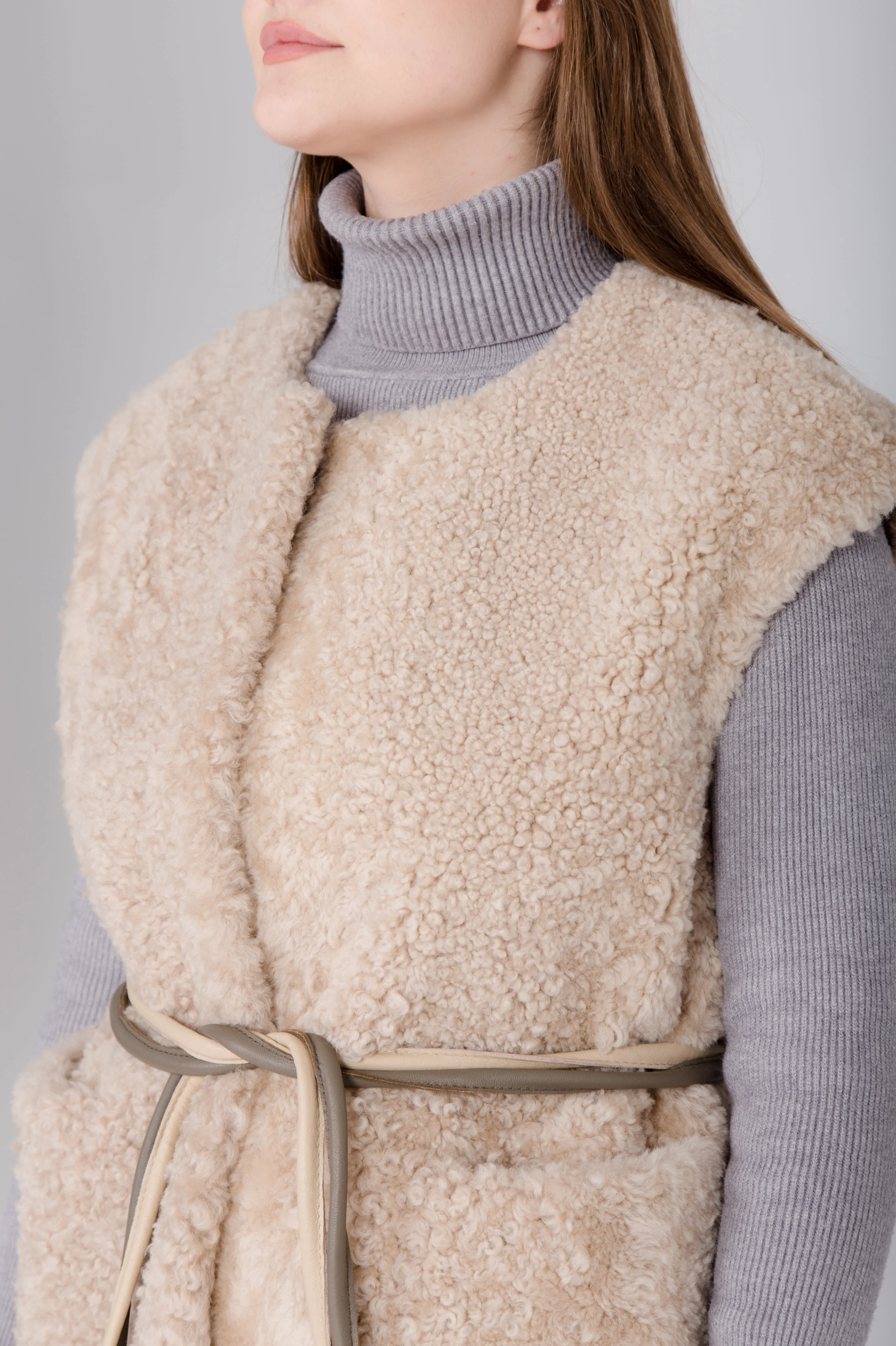 Long Beige Womens Shearling Vest with Boucle Sheepskin and Two Colored Leather Belt